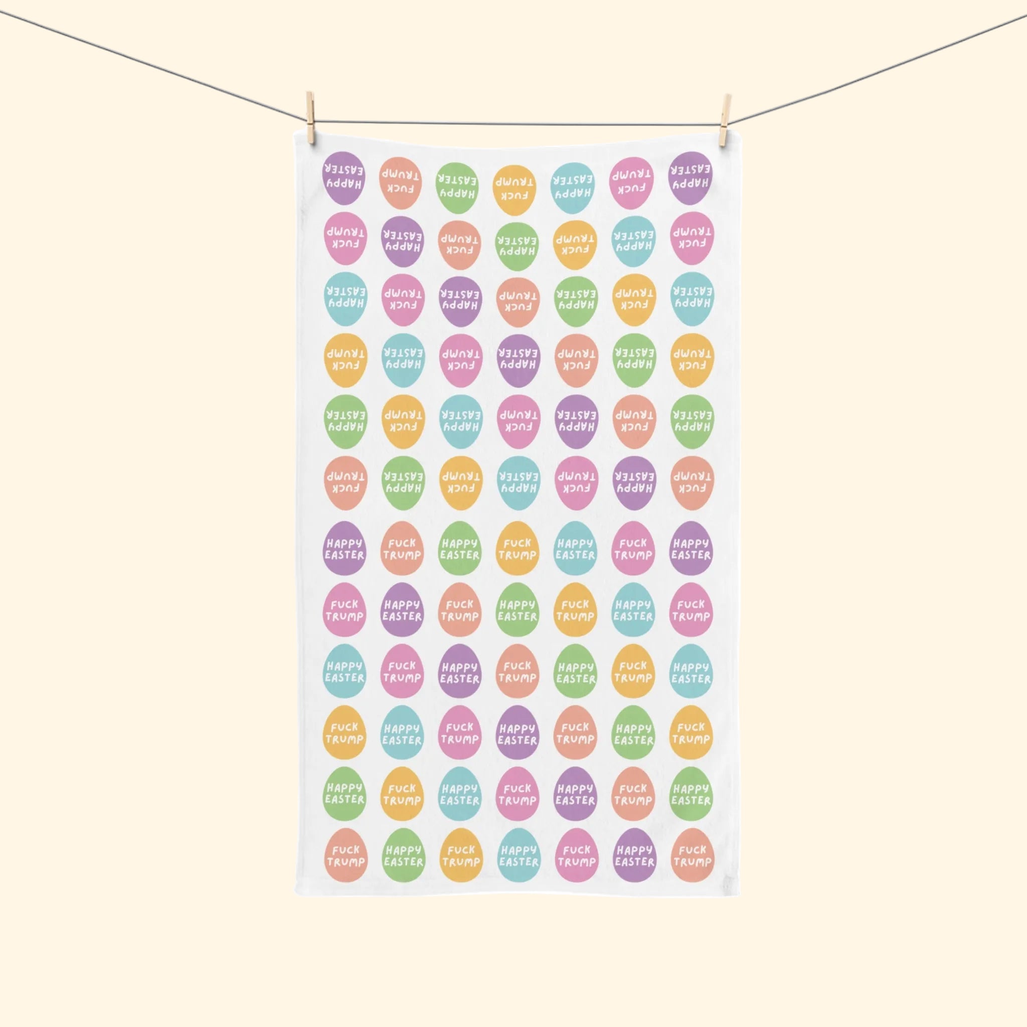 Towel with colorful 'Happy Easter' egg pattern on a white background