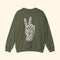 Green sweatshirt with a white peace sign and text on the back against a white background