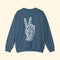 Blue sweatshirt with a white peace sign graphic on the back against a white background