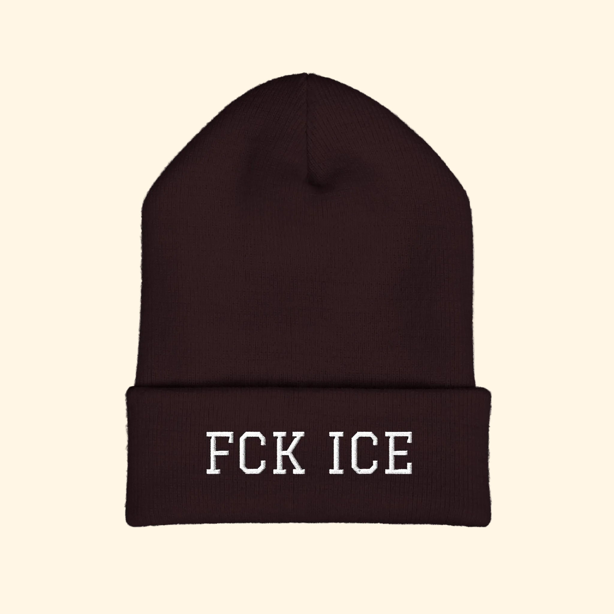 Brown beanie with 'FCK ICE' text on a white background