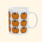 White mug with orange pumpkins and 'Fuck Trump' text on a white background