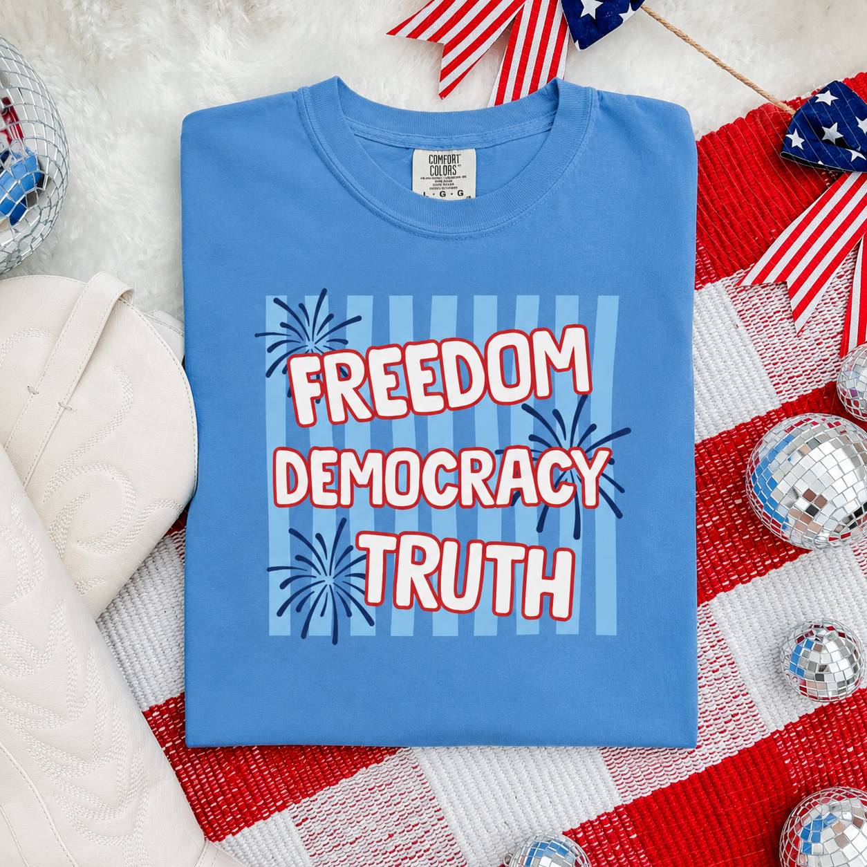 Blue t-shirt with 'Freedom Democracy Truth' text on a red, white, and blue background.