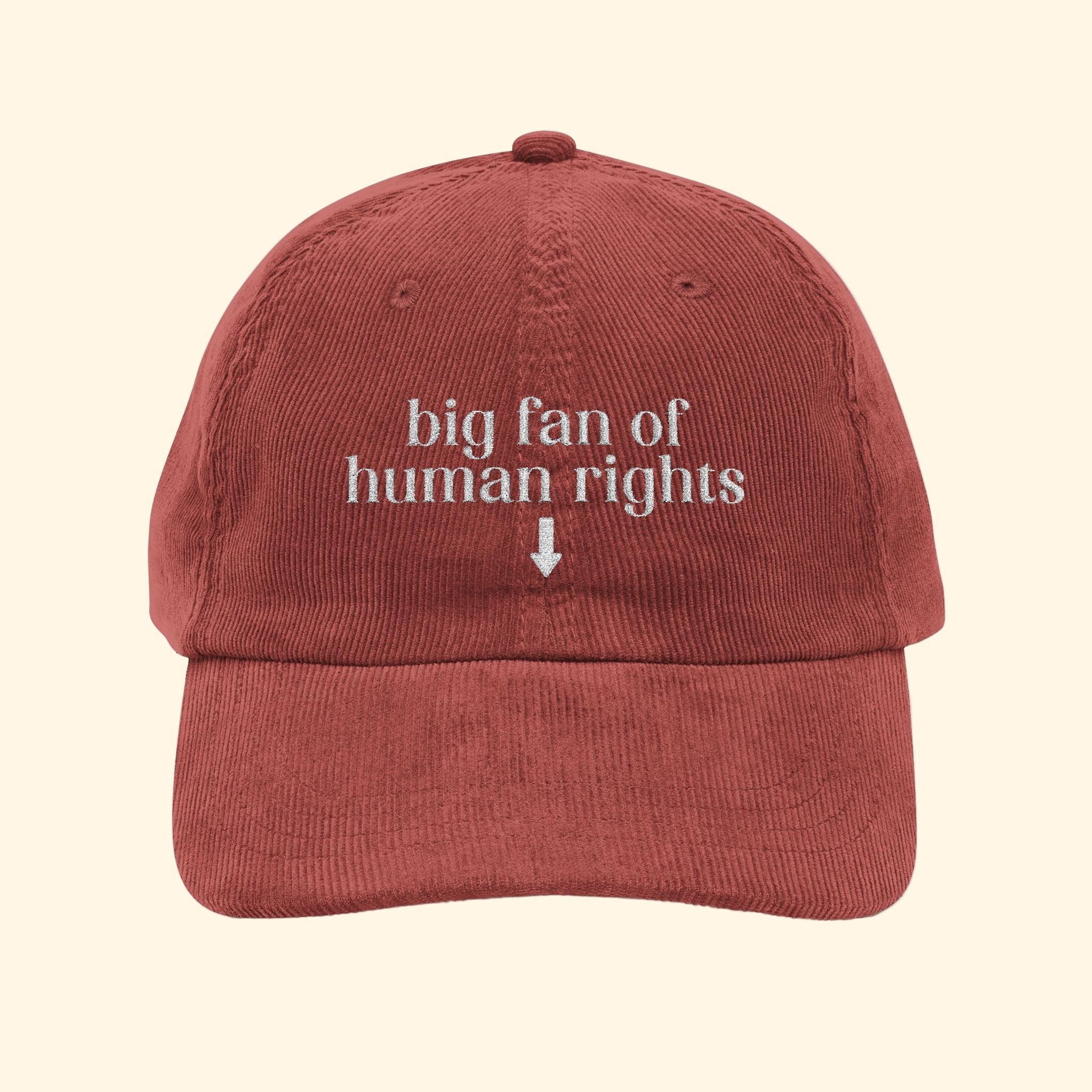 Red cap with 'big fan of human rights' text on a white background