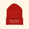 Red beanie with 'Make America Kind Again' text on a white background