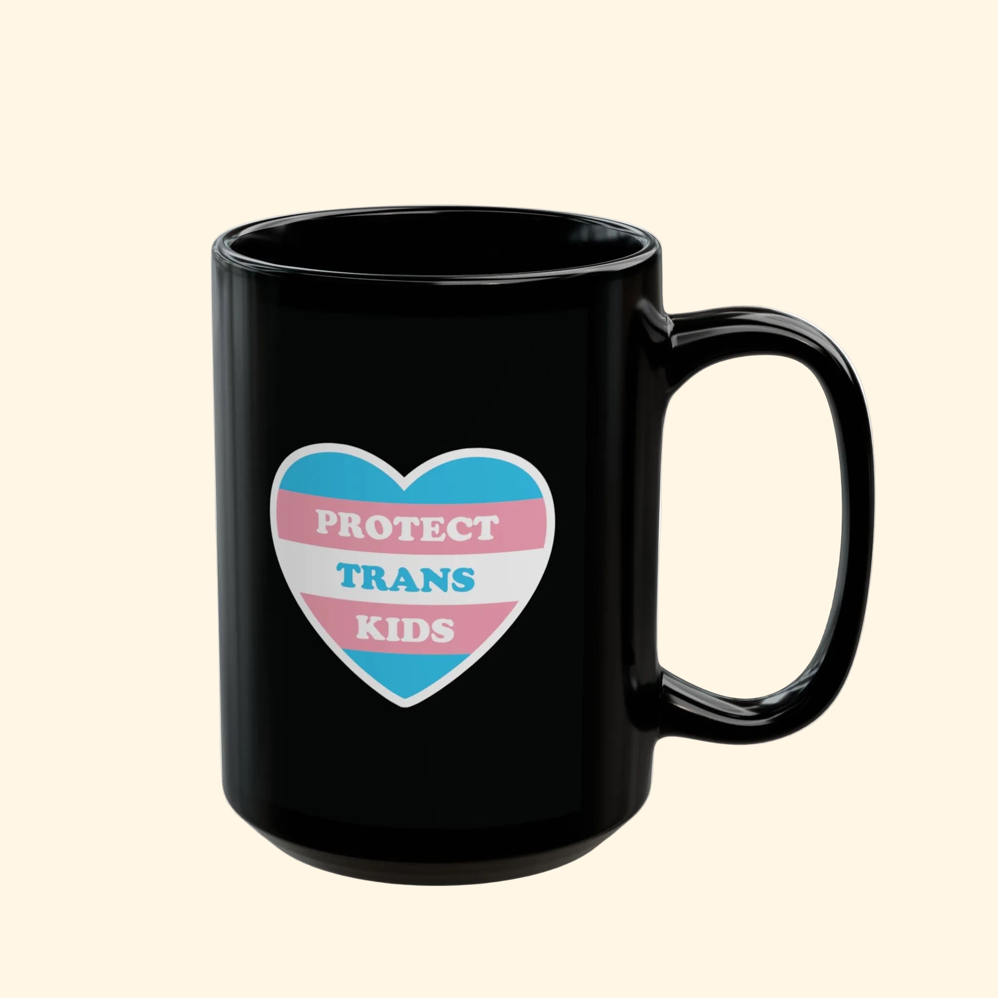 Black mug with a heart-shaped design featuring 'Protect Trans Kids' text on a white background