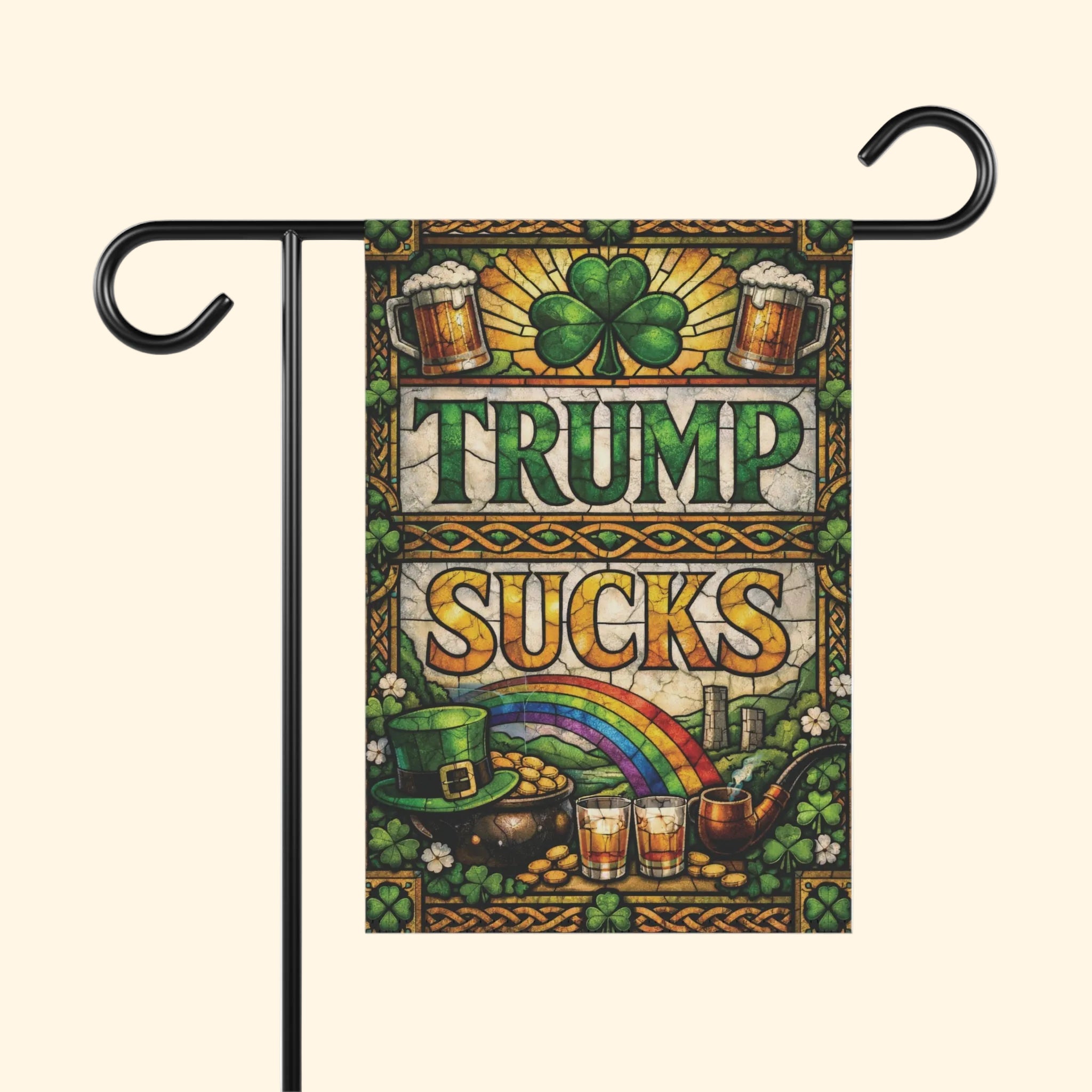 Decorative flag with 'Trump Sucks' text, shamrock, rainbow, and St. Patrick's Day elements on a white background.