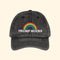 Black cap with rainbow and 'TRUMP SUCKS' text on a white background